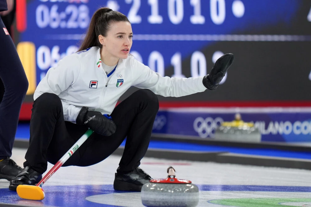 Angela Romei sugli spalti e contesto mediatico durante le Olimpiadi di Cortina